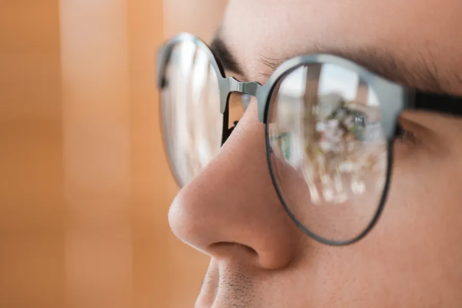 Close-up of a man wearing glasses